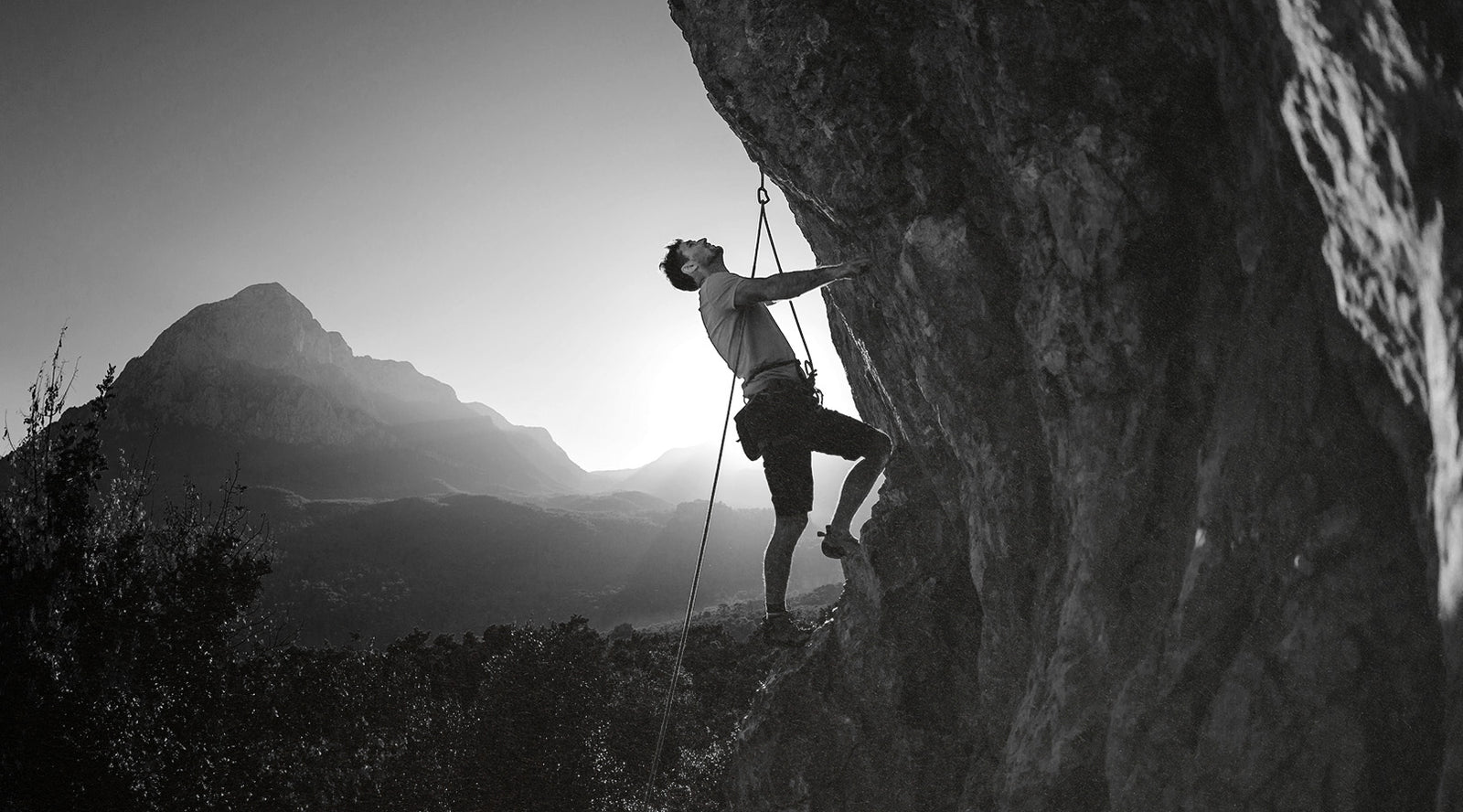 Man Climbing a Rock Wall
