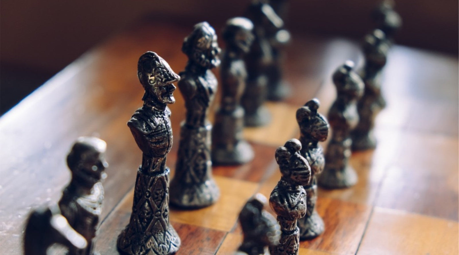 Grayscale Photo of Person Holding Chess Piece · Free Stock Photo