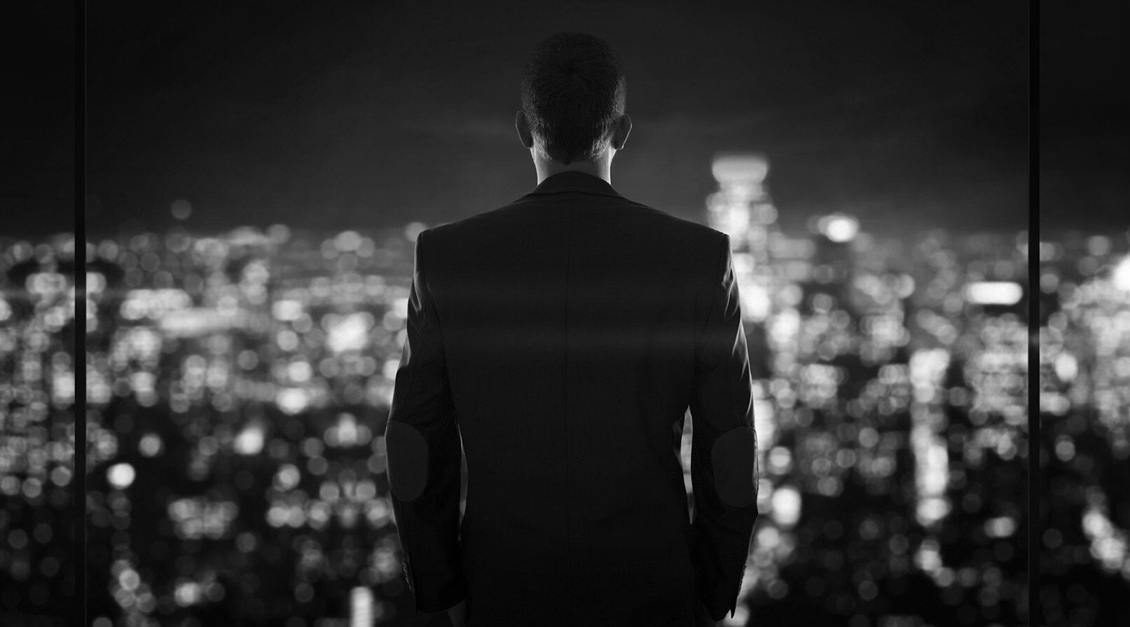 Man Looking at a City Skyline
