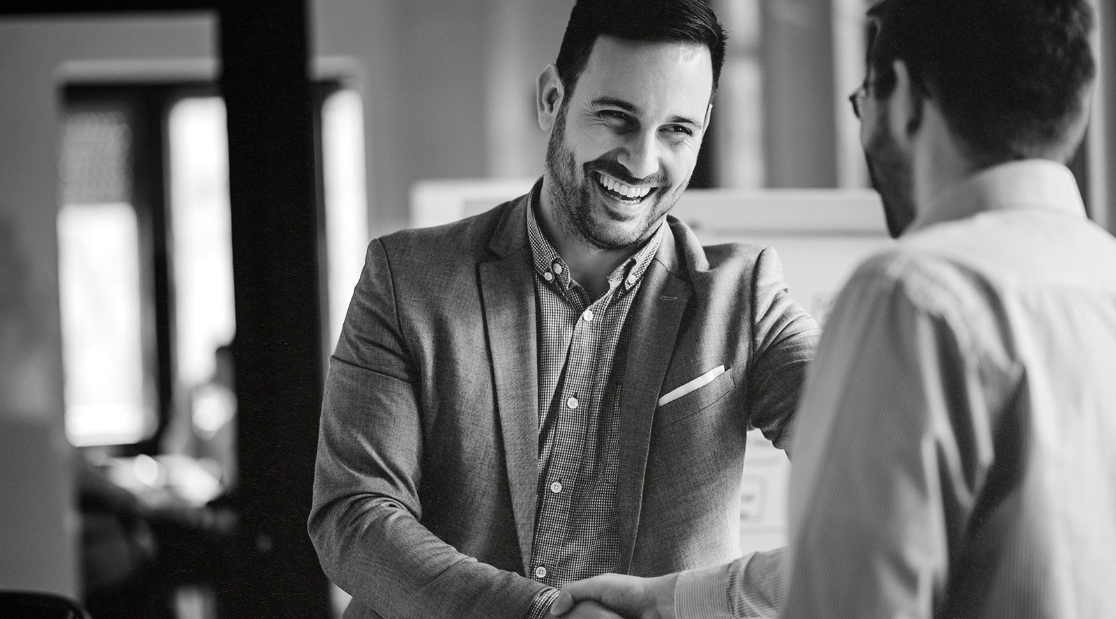 Man Shaking Hands With Another Man