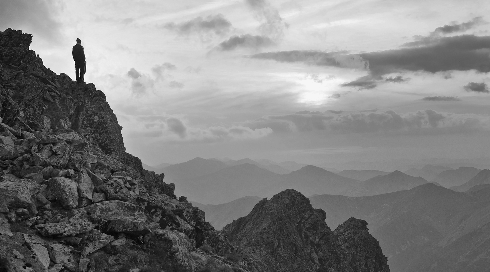 Man Standing on the Mountainside