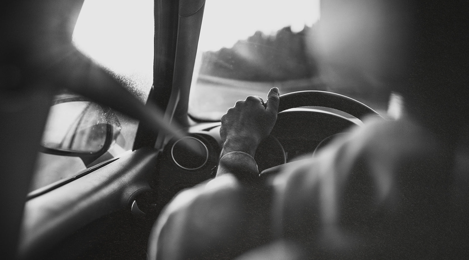 Man Holding a Steering Wheel