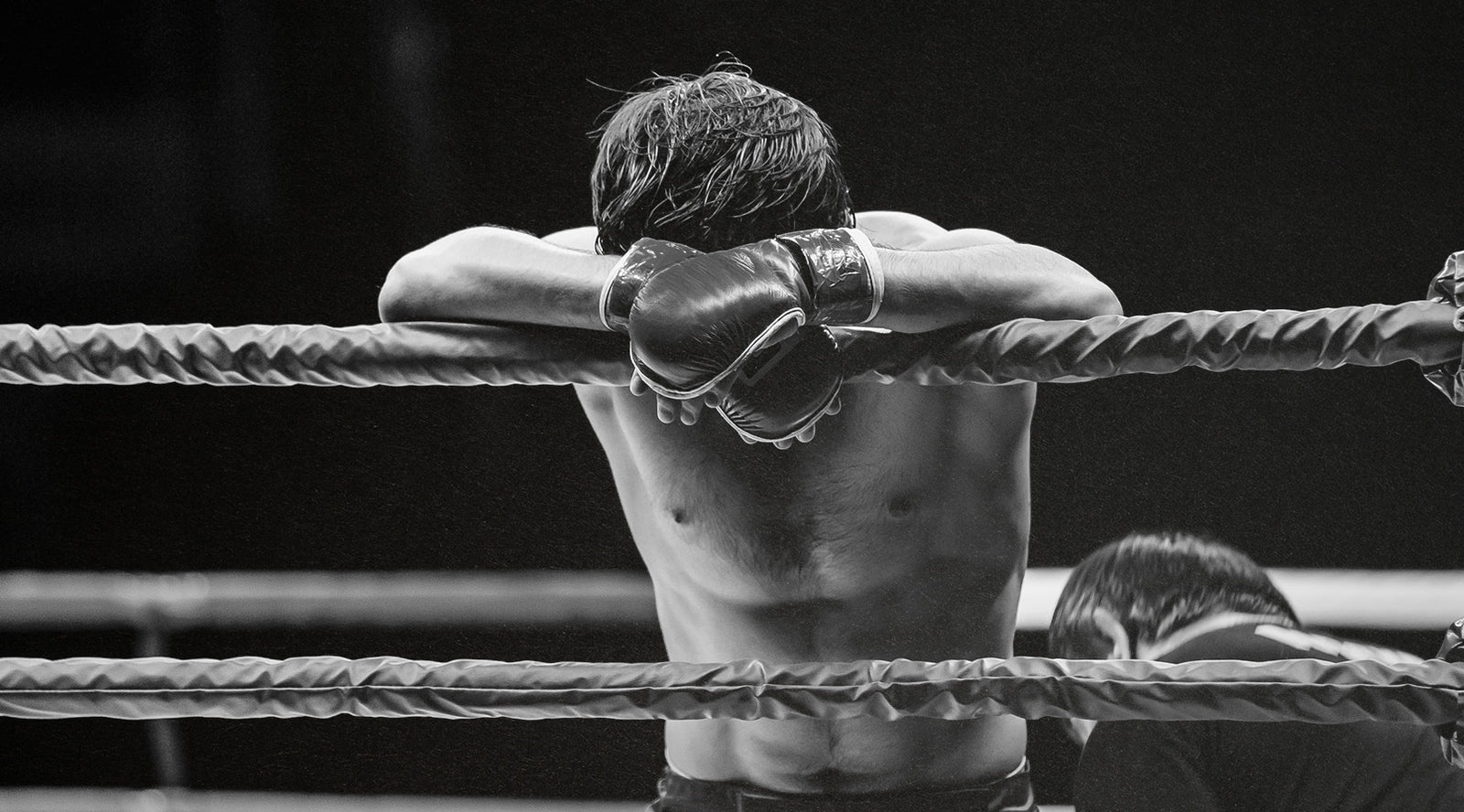 Man Tired in a Boxing Ring