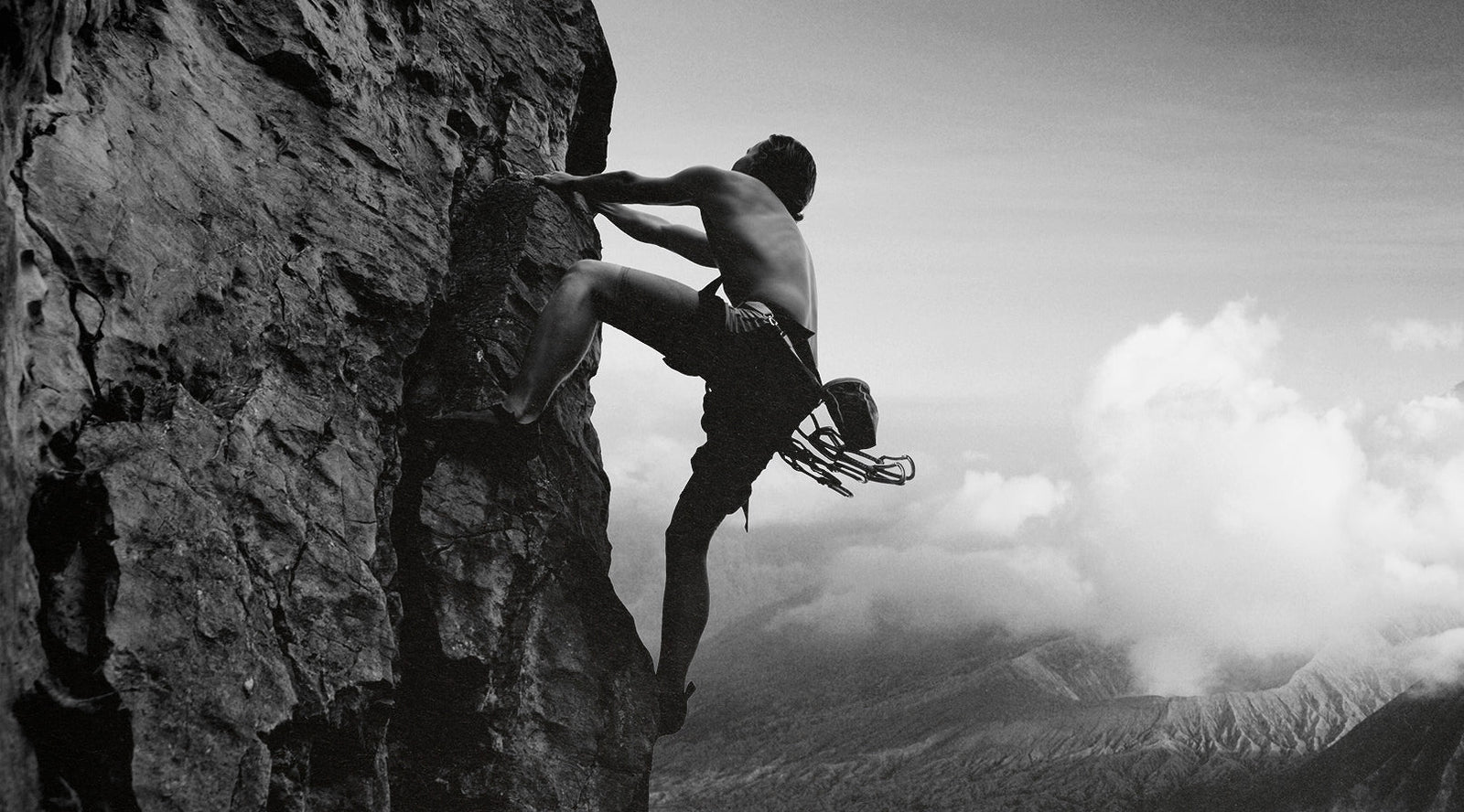 Man Climbing a Rock Wall